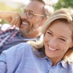 Full Arch Dental Implant Patients Smiling Together