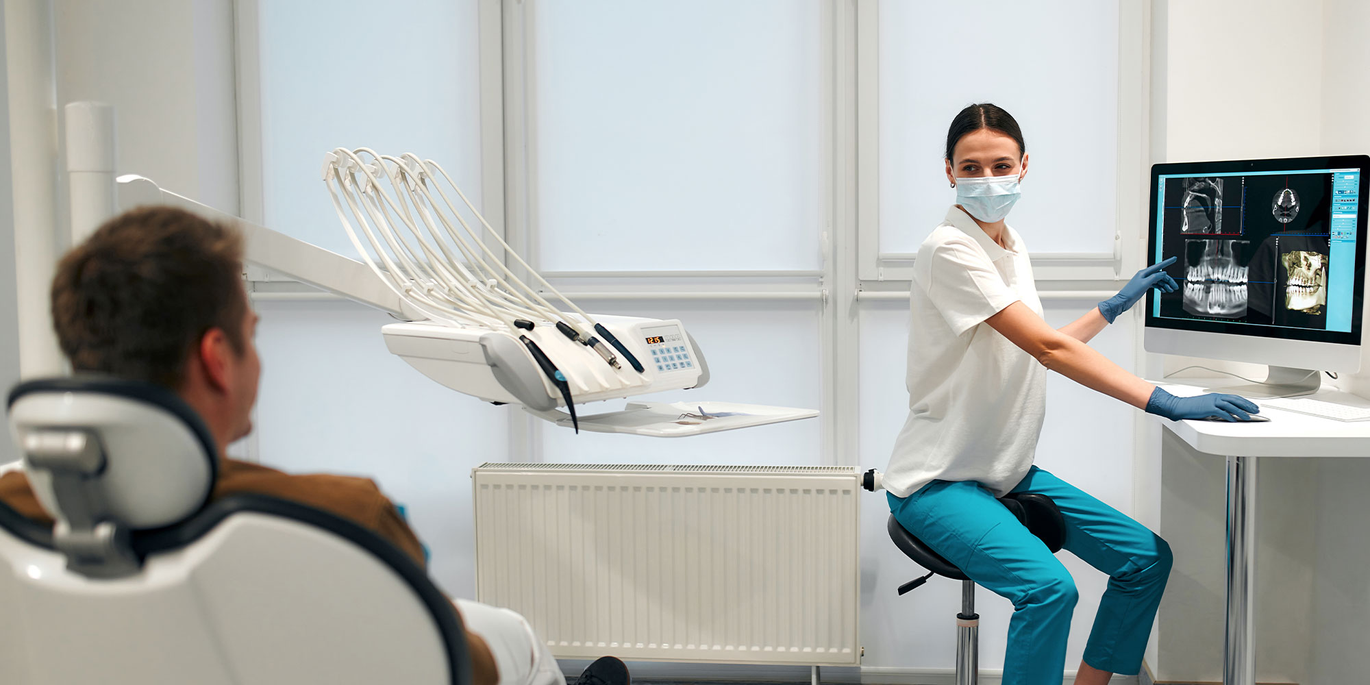 dental assistant showing digital scans