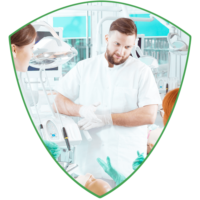 dentist during course showing what to do