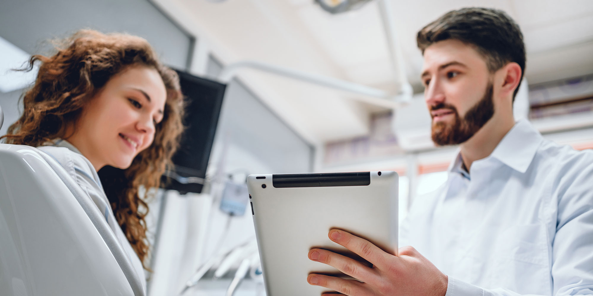 assistant showing info on ipad