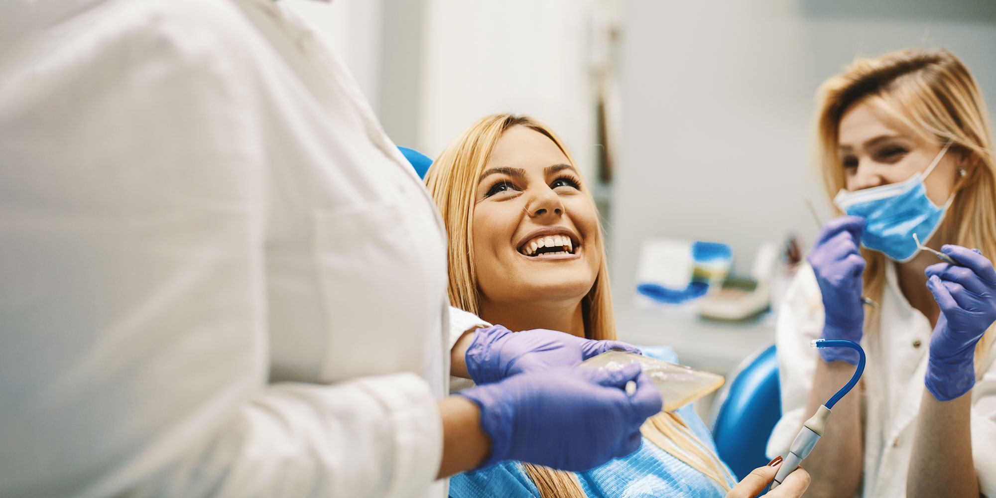 patient smiling in dental chair after